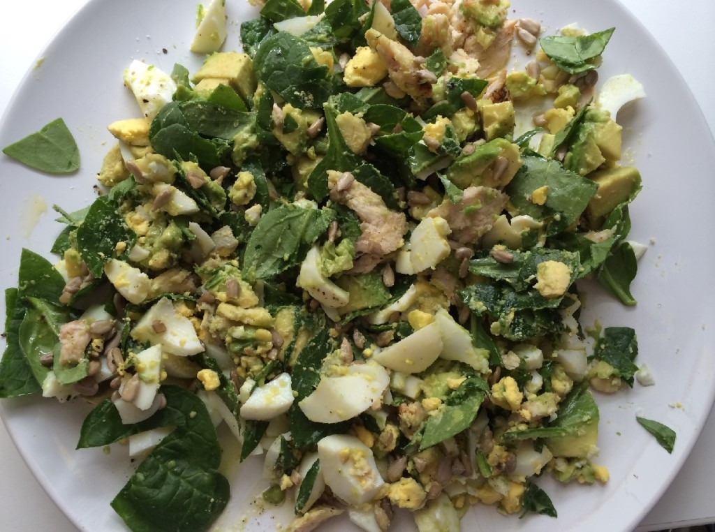 Salad with spinach, grilled chicken, hard boiled egg, avocado, sun flower seeds and a little EVOO.