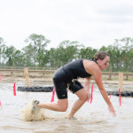 woman-splashing-through-mud-run-race