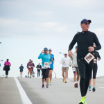 runners racing over bridge