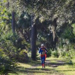 Man running on trails in costume
