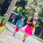 lady in costume walking with kids