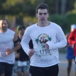 man in white shirt running