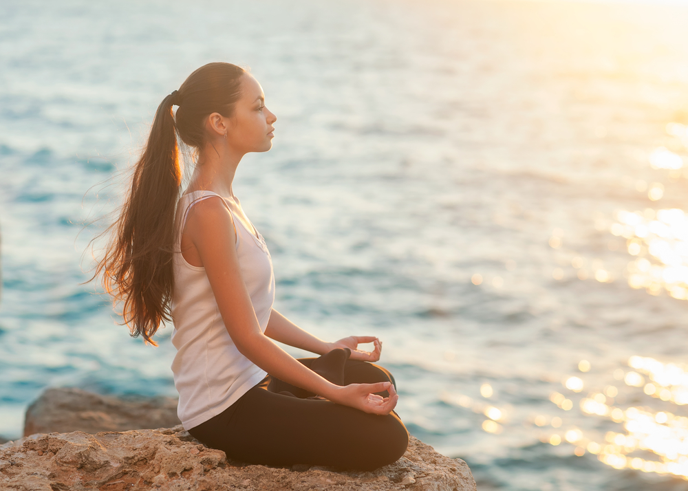 Woman doing yoga | Fit Nation Magazine