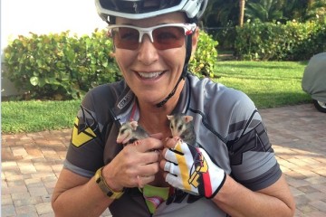 Tish Kelly with two opossums she rescued