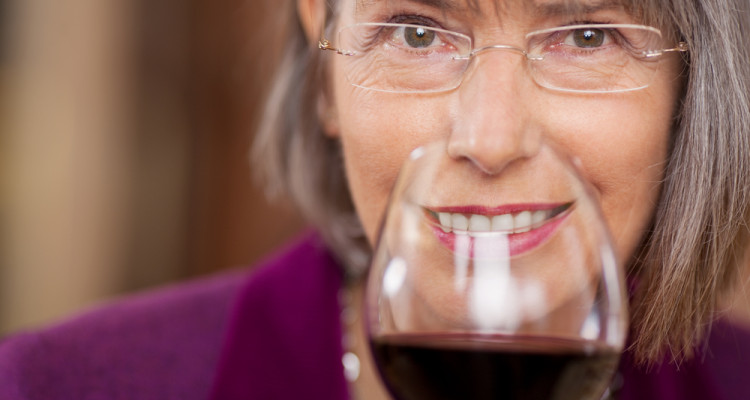 older woman drinking red wine